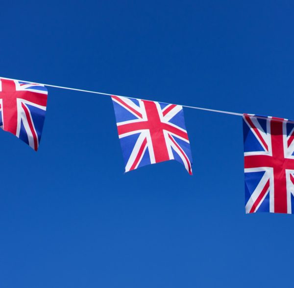 three british flags hanging on a clothes line